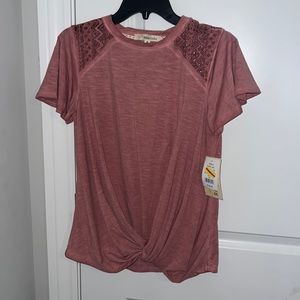 Dark pink shirt.